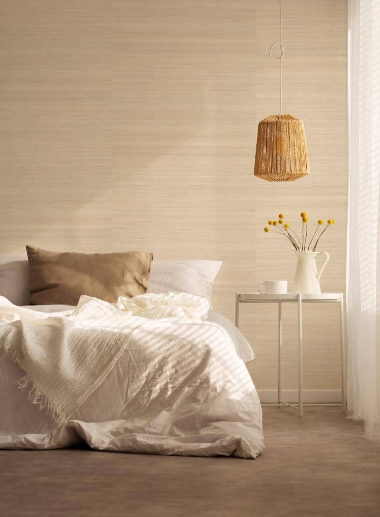 Natural material in bedroom, real photo with copy space on the empty wall